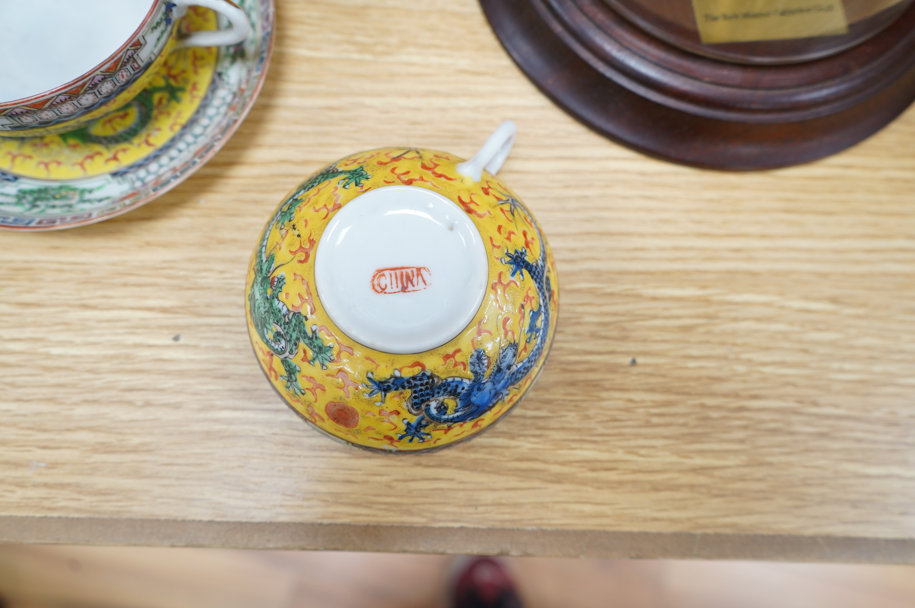 An early 20th century Chinese eggshell porcelain part tea set, with a yellow ground and coloured dragons (22). Condition - cups have slight chipping to top edges